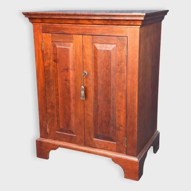 Handcrafted two-door cabinet by Samuel S. Case Cabinetmakers of Virginia. Beautifully figured wood, tall inset panels, a...
