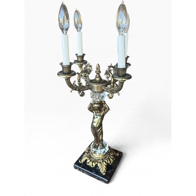 **Vintage Hollywood Regency Four-Light Cherub Candelabra Lamp** A striking vintage four-light candelabra table lamp...