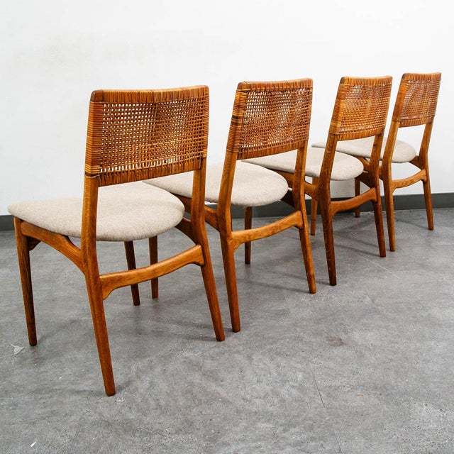 Set of 4 E. Knudsen designed dining chairs. We restored these and reupholstered them in a tan wool fabric. The solid white...