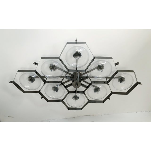 Italian midcentury flush mount with eight clear Murano glass shades mounted on solid brass frame in satin black nickel...