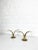 A pair of the iconic Mid Century brass candle holders “Lily”. Manufactured in Sweden by Ystad Metall, design by Ivar...