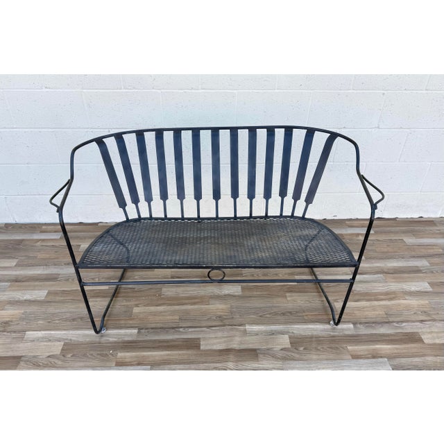 Bring iconic Mid-Century Modern style to your outdoor living space with this vintage wrought iron patio loveseat/bench in...