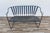 Bring iconic Mid-Century Modern style to your outdoor living space with this vintage wrought iron patio loveseat/bench in...