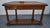 Vintage (1970's) Console Table has a French Provincial Style. Made by Ethan Allen. The Wood is Cherry Wood. The Table has...