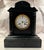 This listing is for an antique French mantel clock. The case is made from carved slate stone with green marble accents....