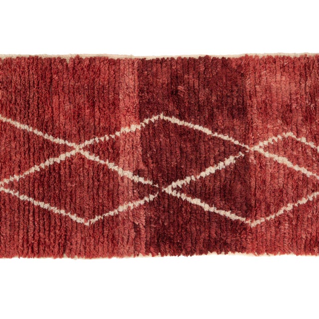 Elegant hand-knotted wool runner rug in Burgundy, highlighted by minimalist Ivory diamond patterns, perfect for enriching...