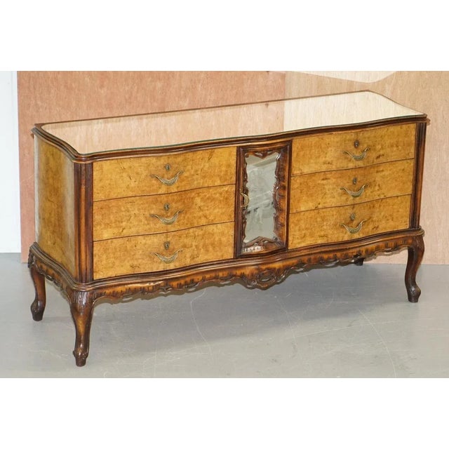 lovely vintage Italian Burr walnut serpentine fronted sideboard with mirrored glass top and etched glass maiden A very...