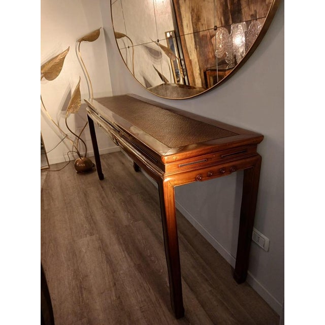 Table console in Chinese style, made in wood, rattan and bamboo. The console is perfect for an entrance, a living room or...