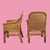 A set of four woven rattan arm chairs with newly done upholstery, pairing vintage frames with fresh, sit-ready comfort....