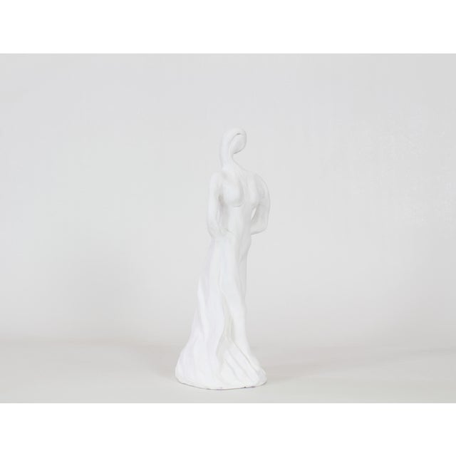 Free form white plaster sculpture depicting a female figure Dimensions; 5"Width x 5"Depth x 13.5"Height See pictures and...