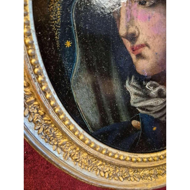 A delicate and spiritually evocative Baroque devotional painting depicting the Virgin Mary in profile, shown with her head...