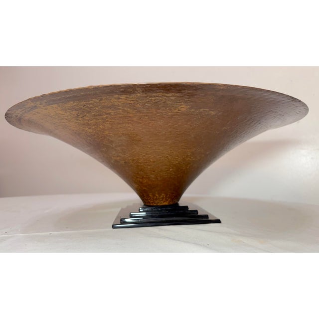 The Large Mid-Century Modern hand hammered copper and glass footed centerpiece bowl is a stylish and unique piece that...