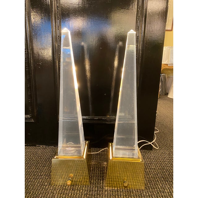Chapman Lucite and Brass Obelisk Lamps Dramatic brass and lucite obelisk table lamps. These geometric, minimalistic lamps...