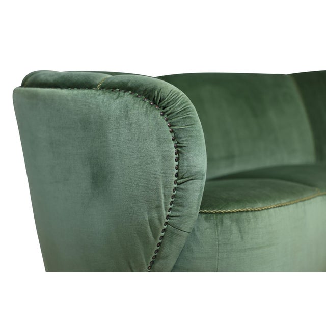 1930s Danish Deco curved-back settee attributed to Flemming Lassen, retaining its original green mohair upholstery....