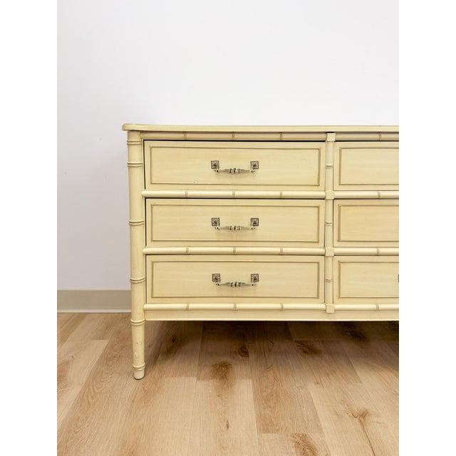 This lovely vintage Henry Link Bali Hai 6-drawer dresser in cream is a beautiful and highly collectible Hollywood Regency...