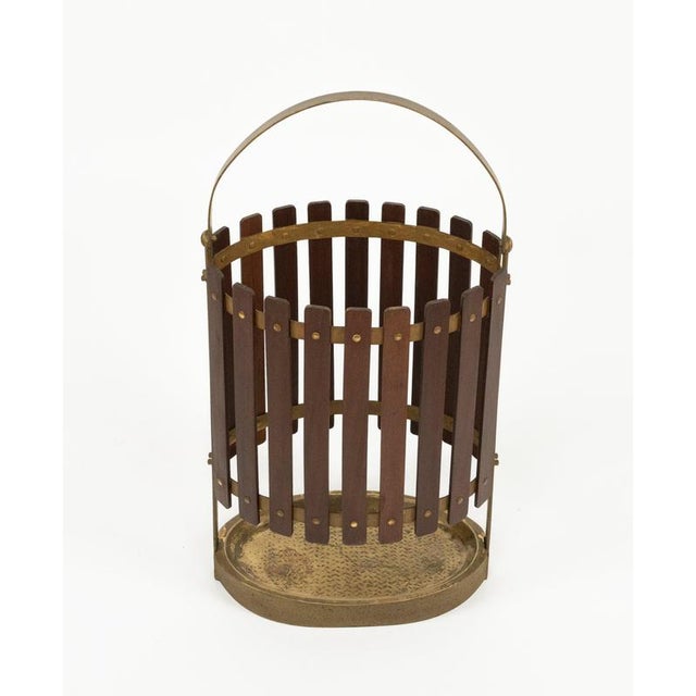 Midcentury beautiful umbrella stand in teak wood and gilded iron with handle. Made in Italy in the 1960s.
