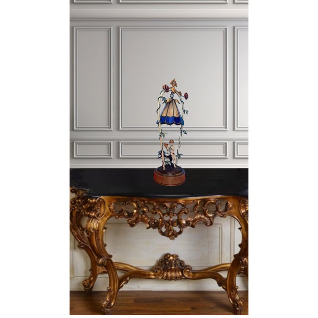 This one-of-a-kind lamp is a stunning fusion of vintage lamp parts. At the heart of the lamp is a charming cherub blowing...