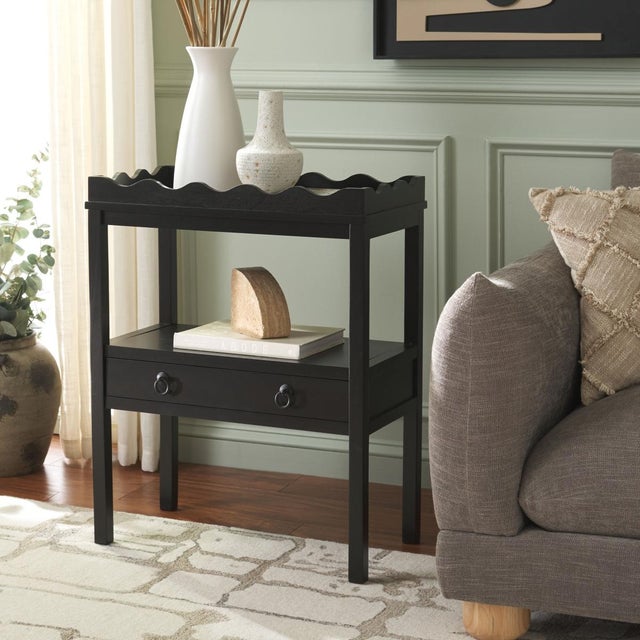 Enhance your space with the Darlyn Rectangle Accent Table in a soothing matt black hue. This versatile table features a...