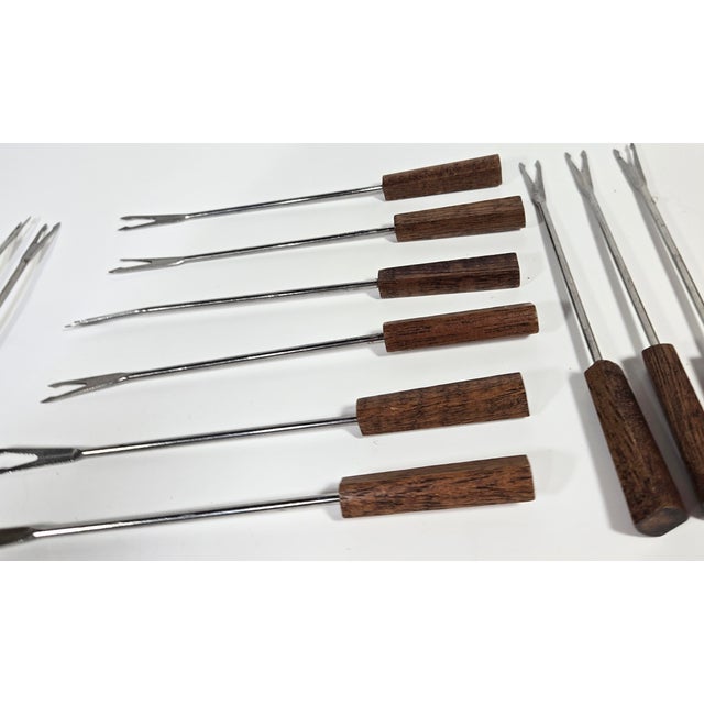 This chunky mid century danish style in a gorgeous cubed walnut features stainless steel forked ends, making for a stylish...