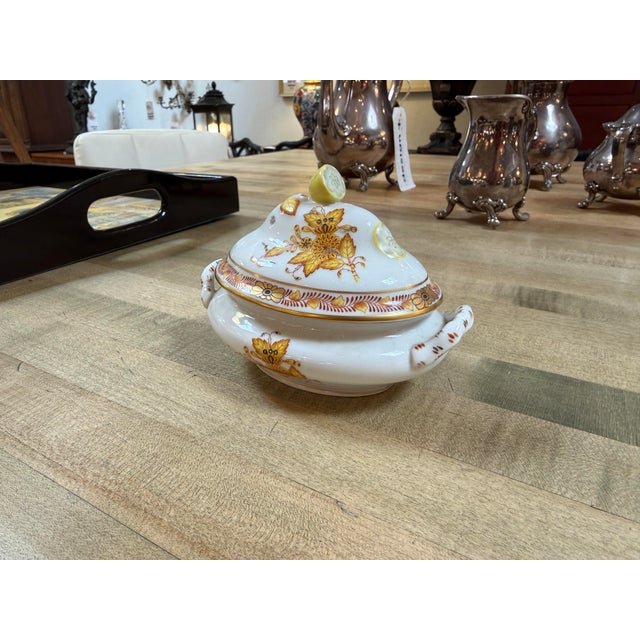 Design Plus Gallery pressers a Porcelain Lemon-Finial Covered Dish from Herend. This hand-painted Hungarian porcelain...