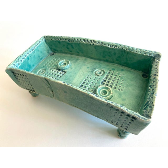 This vintage 1980's organic Modernist studio art pottery signed Abstract footed rectangle decorative ceramic bowl is a...