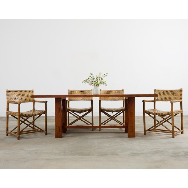 Contemporary trestle dining table made in the decorative arts and crafts taste. The table features a thick rectangular top...