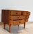 This vintage Scandinavian side table features six dovetailed drawers and discreet patinated metal handles. Crafted from...