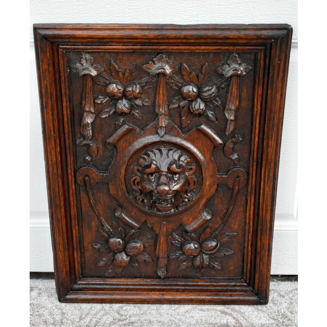 Antique - Late 19th Century Plaque with Ornately Carved Lion Details. The Wood is Oak. The Plaque has a Tudor Style. The...