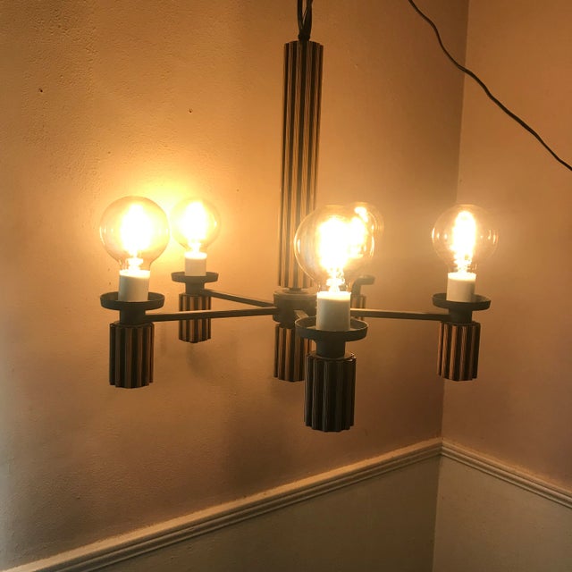This is an amazingly beautiful mid century modern (MCM) chandelier with five lights. It includes a chain that is about 4...
