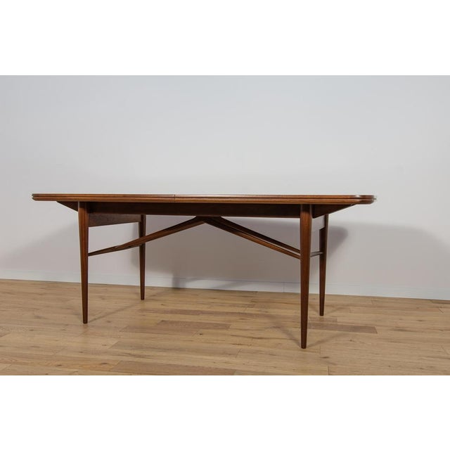 The dining table by designe Robert Hertige for the British manufacture Archie Shine in the 1950s. The dining table was...