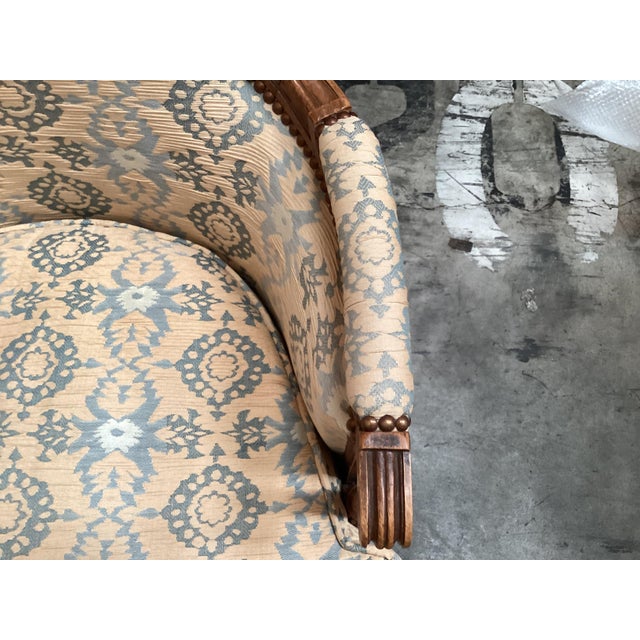 Very elegant pair of Louis XVI style French bergères chairs. Made of French fruitwood, these chairs have a very fine frame...