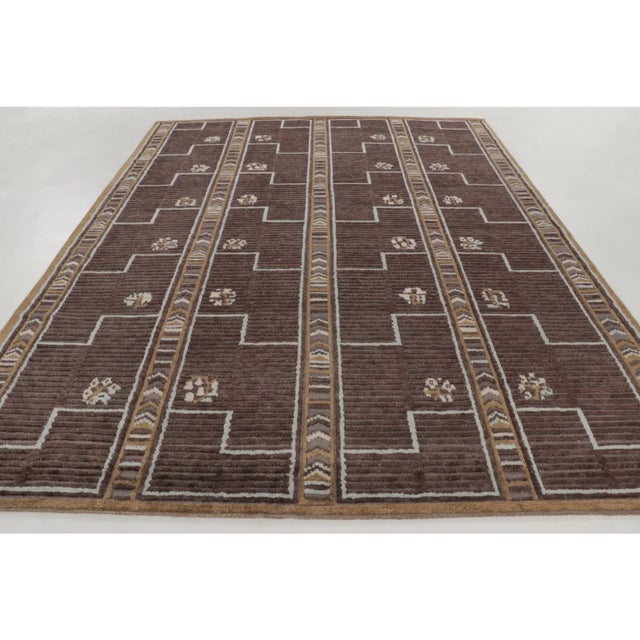 Hand-knotted in wool, this 9x12 contemporary Art Deco rug is a sophisticated addition to Rug & Kilim’s collection. It...