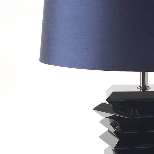 Table lamp in black lacquered wood The lamp base can be made from oak, beech tree or mahogany wood. The wood can be...