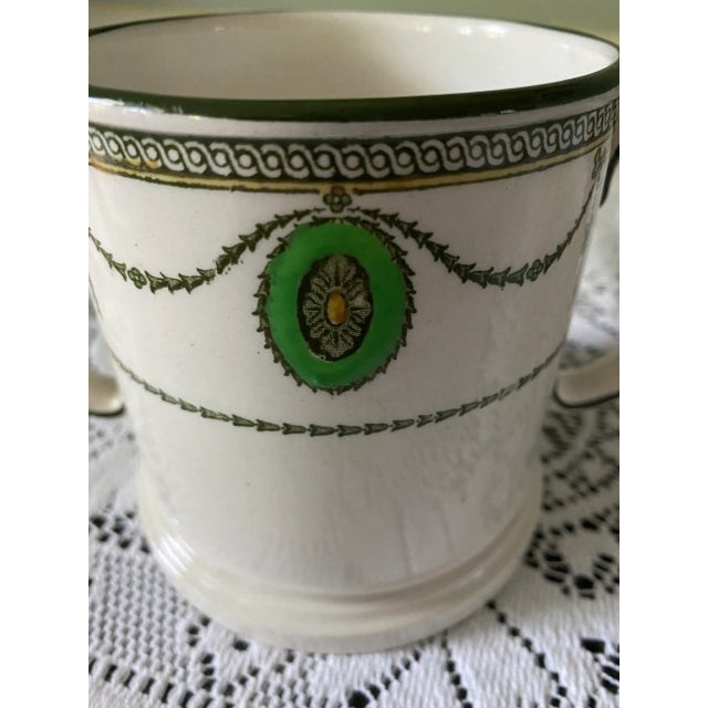 Rare Royal Doulton shaving mug in the green and black “Countess” pattern. The classical design of swags and medallions was...