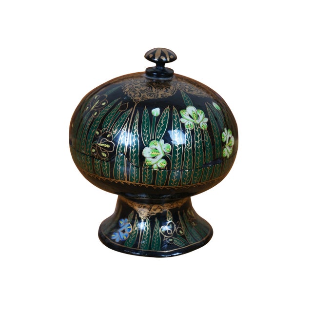 Vintage black laquered lidded pedestal kashmir / kashmiri papier mâché box made in India. It features a floral motif with...