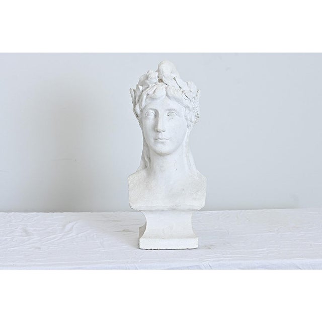French vintage bust of an anonymous Greco-Roman lady in larger-than-life scale, her noble likeness rendered in chalk-white...