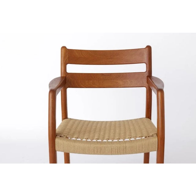 Teak mid-century armchair by Danish manufacturer EMC Mobler. Production period: 1960s. Good, stable condition. Massive...