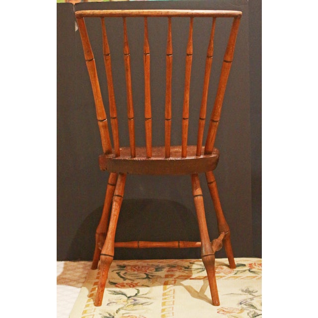 Circa 1830 New England Windsor Side Chair. Saddle seat. Raised on turned, widely splayed legs. Pine, maple & hickory. A...