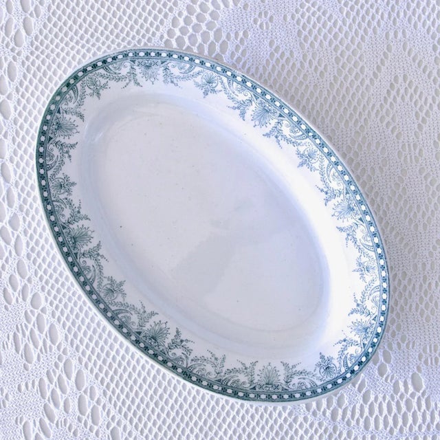 Large old oval dish from the end of the 19th century to the beginning of the 20th century, stamped Moulin des Loups, blue...