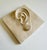 A handmade plaster wall-hung plaque featuring an anatomical human ear. Historically, these types of reliefs—often molded...