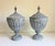 A matching pair of large, antique lead metal lidded garden urns modeled in an English Neoclassical or Adam style...