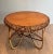 This very beautiful and unusual round coffee table is made of very beautiful rattan work with a wooden top. This is an...