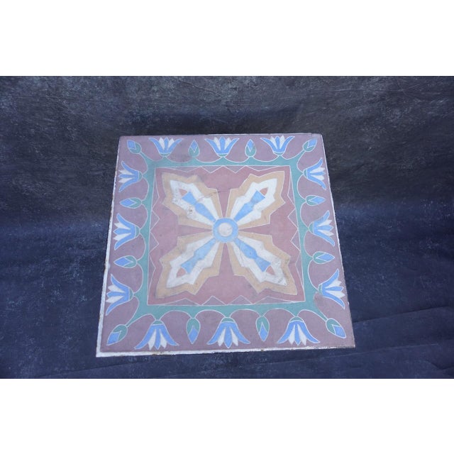 Spanish Revival meets Egyptian Revival tile-top table, likely 1930s. The ceramic tile features a bold, symmetrical design...
