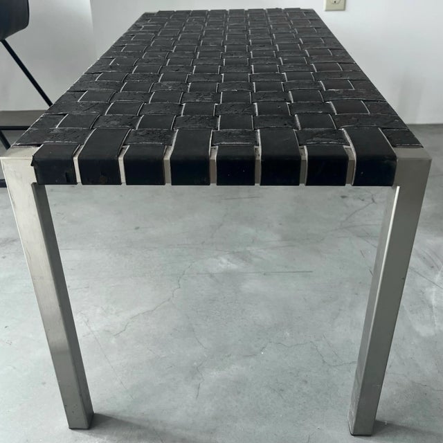 Steel frame bench with black leather strapping. This bench is similar to pieces by designers Douglas Kelly, Ross Littell,...