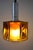 Scandinavian ceiling light from the 1960s. Bottle green glass with honeycomb amber colored inner glass. Designed by Carl...