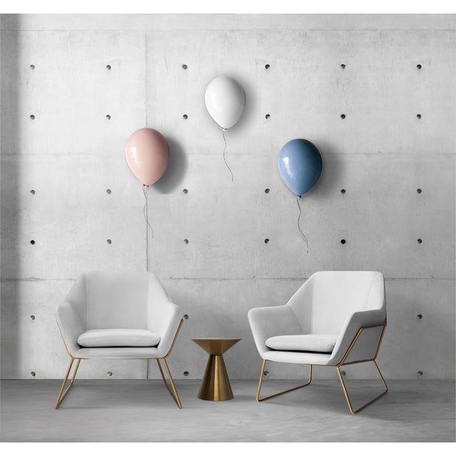 Add a unique sense of individuality into your space with this stylish ceramic white balloon wall sculpture. Handcrafted...