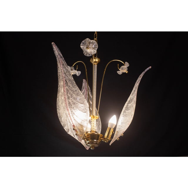 Delightful Murano chandelier in the style of Franco Luce. The chandelier consists of three large pink and transparent...