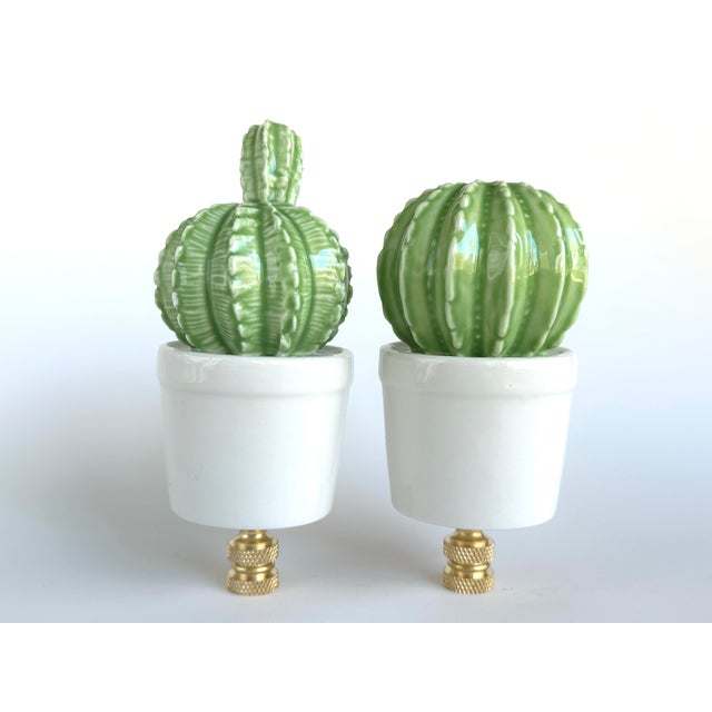 Pair of lamp finials featuring ceramic potted succulents sized to fit a standard-size lamp harp with a 1/4" stem.