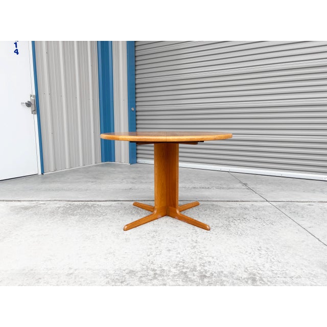 ✨ 1960s Danish Modern Teak Round Extension Dining Table ✨ This beautifully crafted Danish Modern dining table, made in...