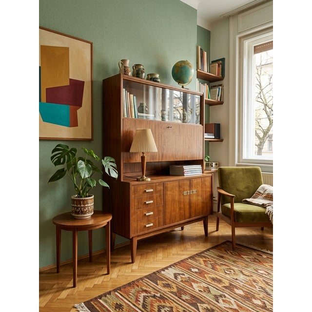 An exceptional example of Hungarian mid-century design, this sideboard/bar cabinet has been professionally restored to...